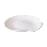 White ceramic dish shaped like 80s shells