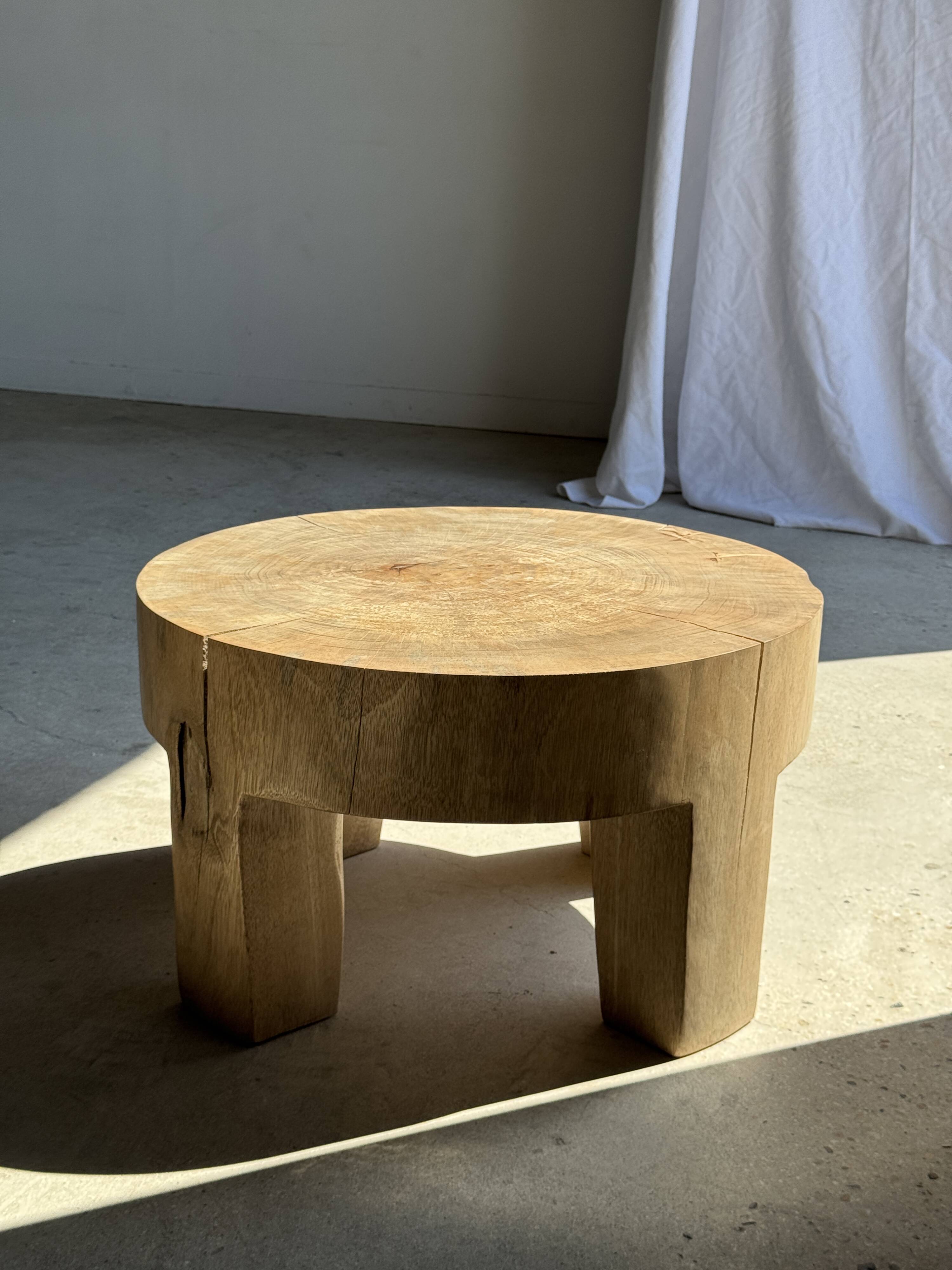 Coffee table, four-legged low table in natural solid monoxyle mango wood.