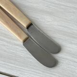 Pink bakelite butter knives.