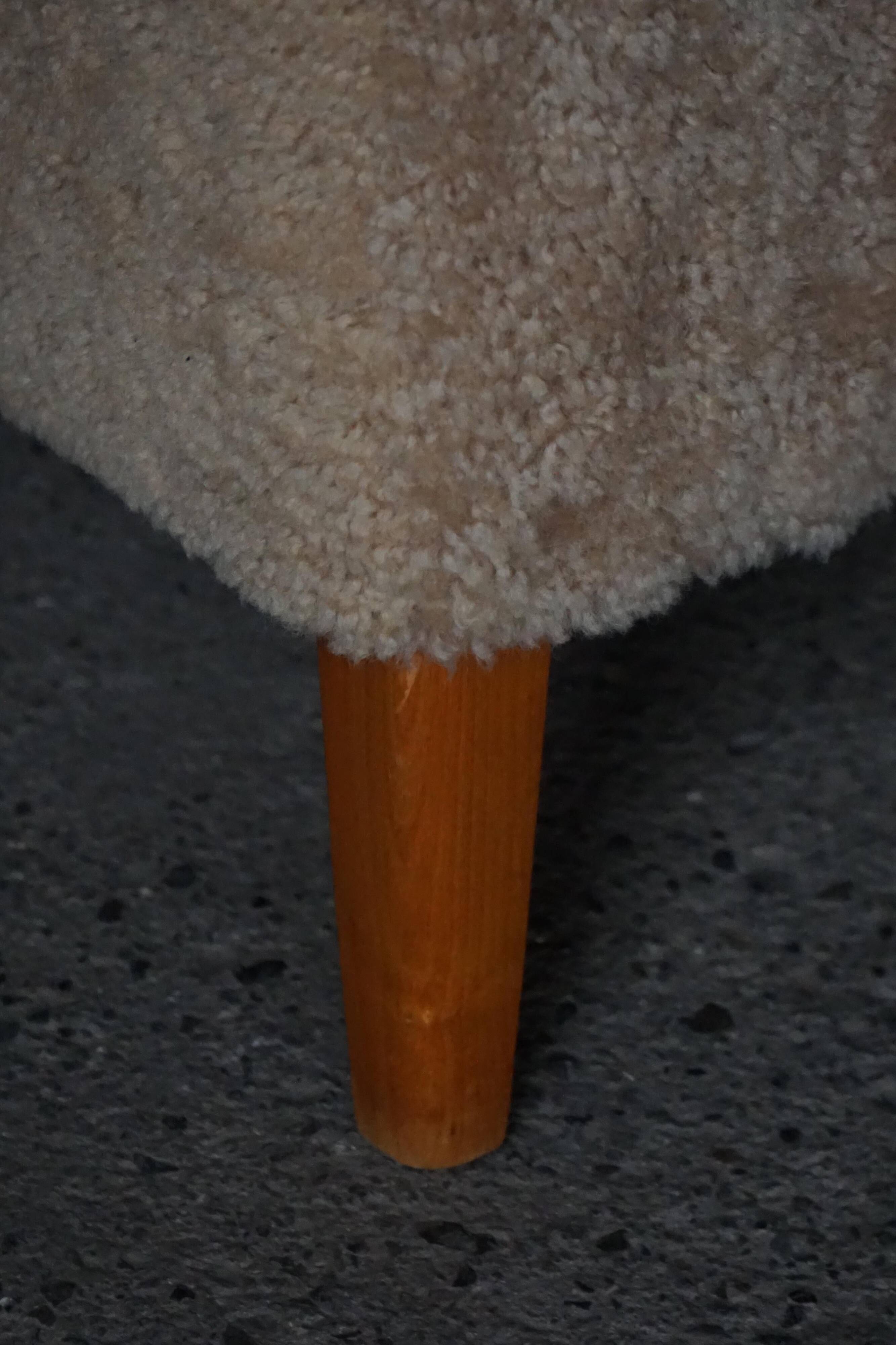 Pair of Mid Century Modern Swedish lounge chairs in birch and lamb's wool, 1960s.