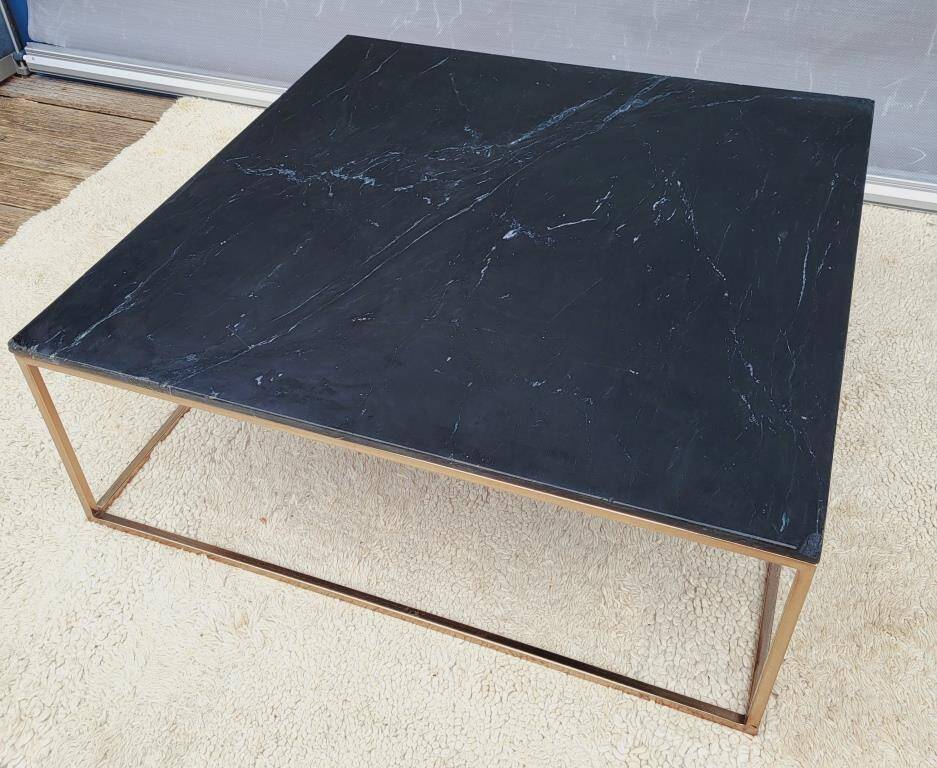 Coffee table or black marble and brass display "in its own juice"