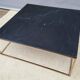 Table basse en marbre noir et laiton