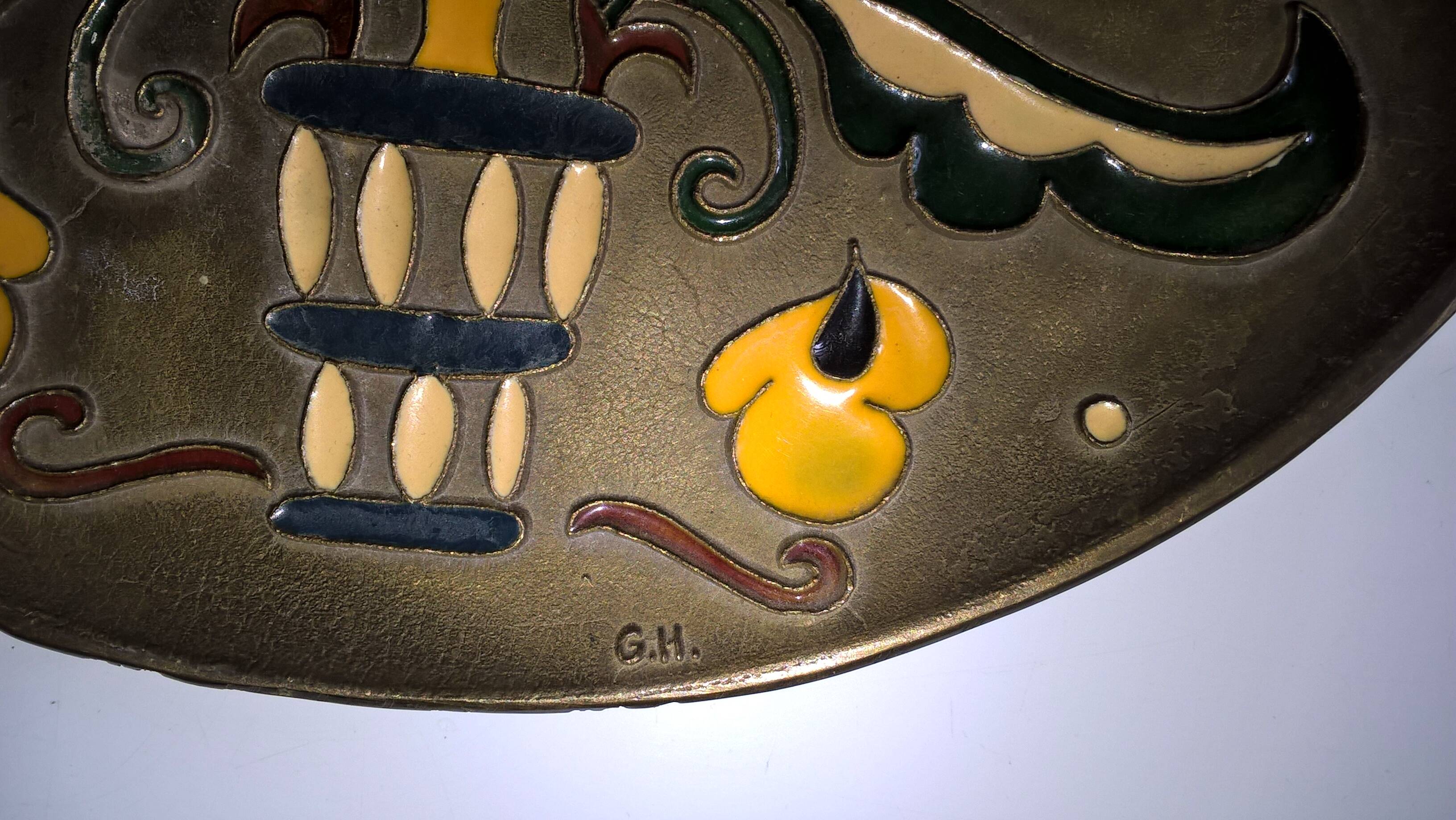 Old decorative brass and enamel wall plate signed GH