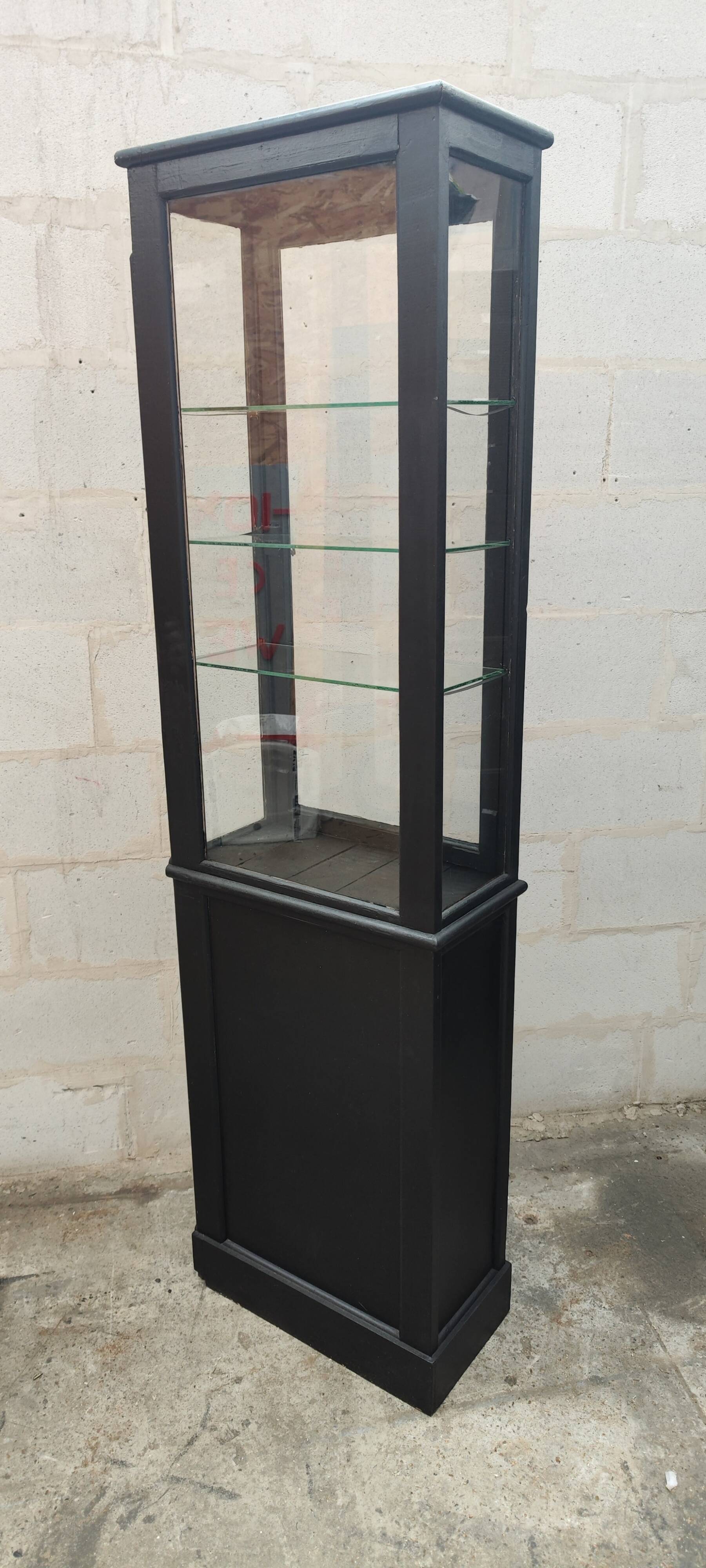 Old two-door shop showcase with black patina