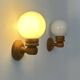 Pair of vintage wall lights, pine and opaline glass, France, 1980