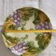 Lot of 4 Onnaing barbotine plates with grapevine design.