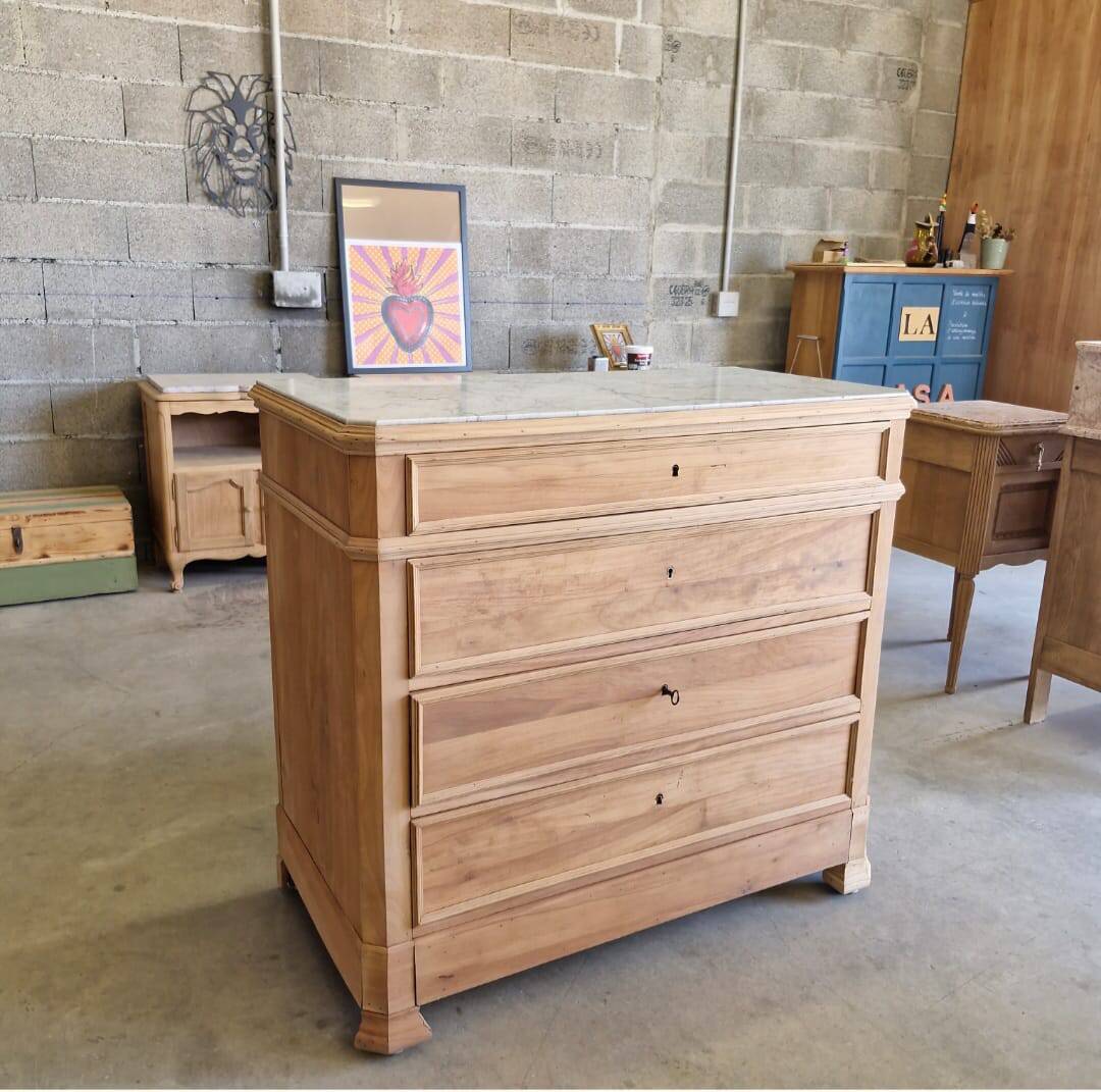 Walnut chest of drawers with white marble.