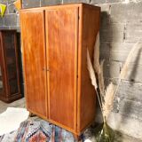 Vintage wooden cabinet with compass feet