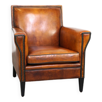 Fauteuil au design Art Déco en peau de mouton élégant avec de beaux détails