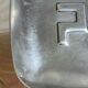 Vide-poche monogrammé en acier, années 70