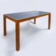 Pine table with a top covered in linoleum.