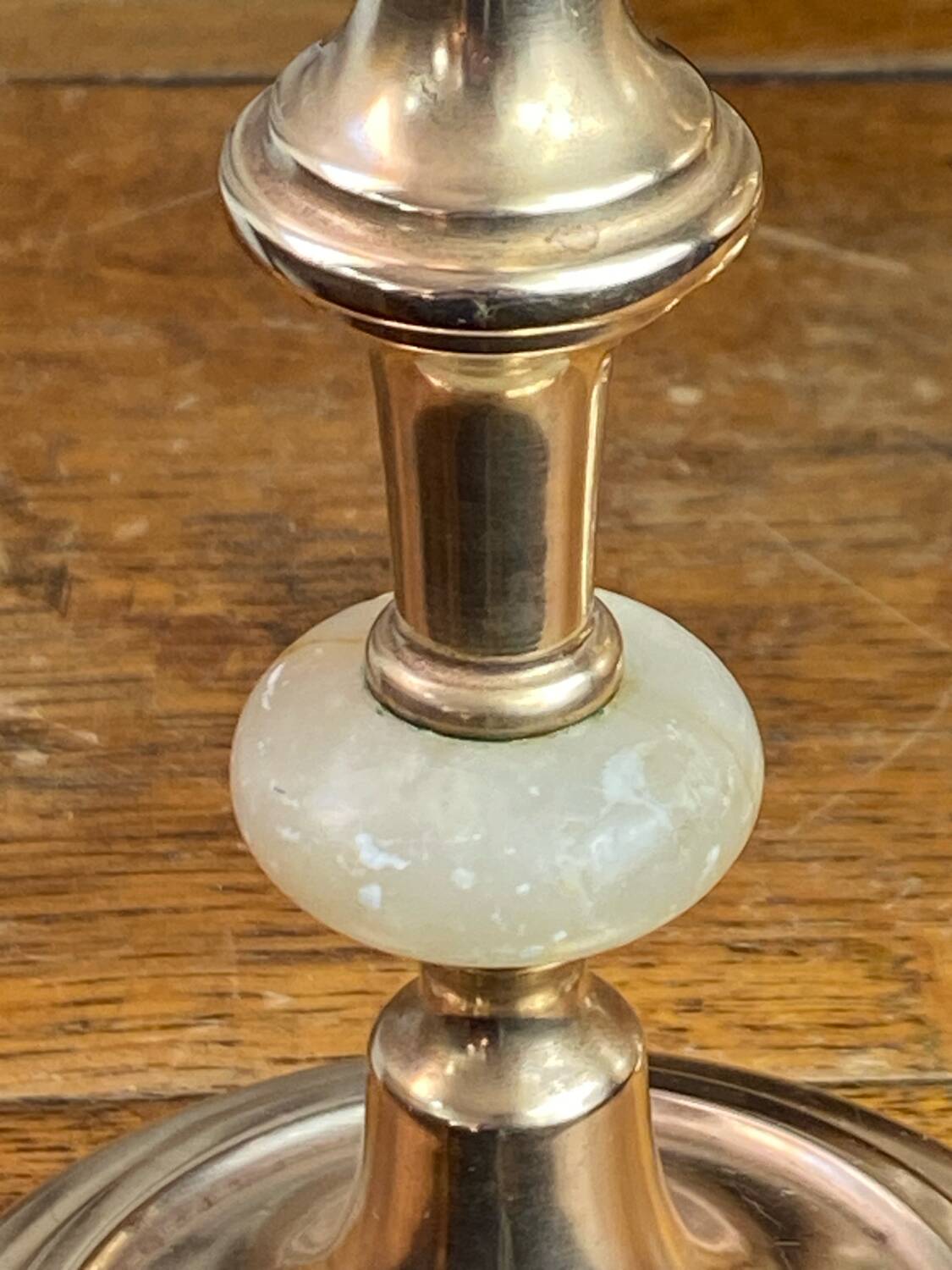 Pair of brass and stone candlesticks