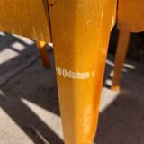 3 vintage bridge chairs with rounded armrests.