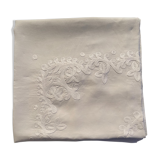 White hand-embroidered square tablecloth at stem stitch