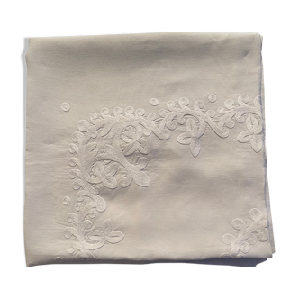 White hand-embroidered square tablecloth at stem stitch