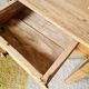 Small old farmhouse table in raw wood.