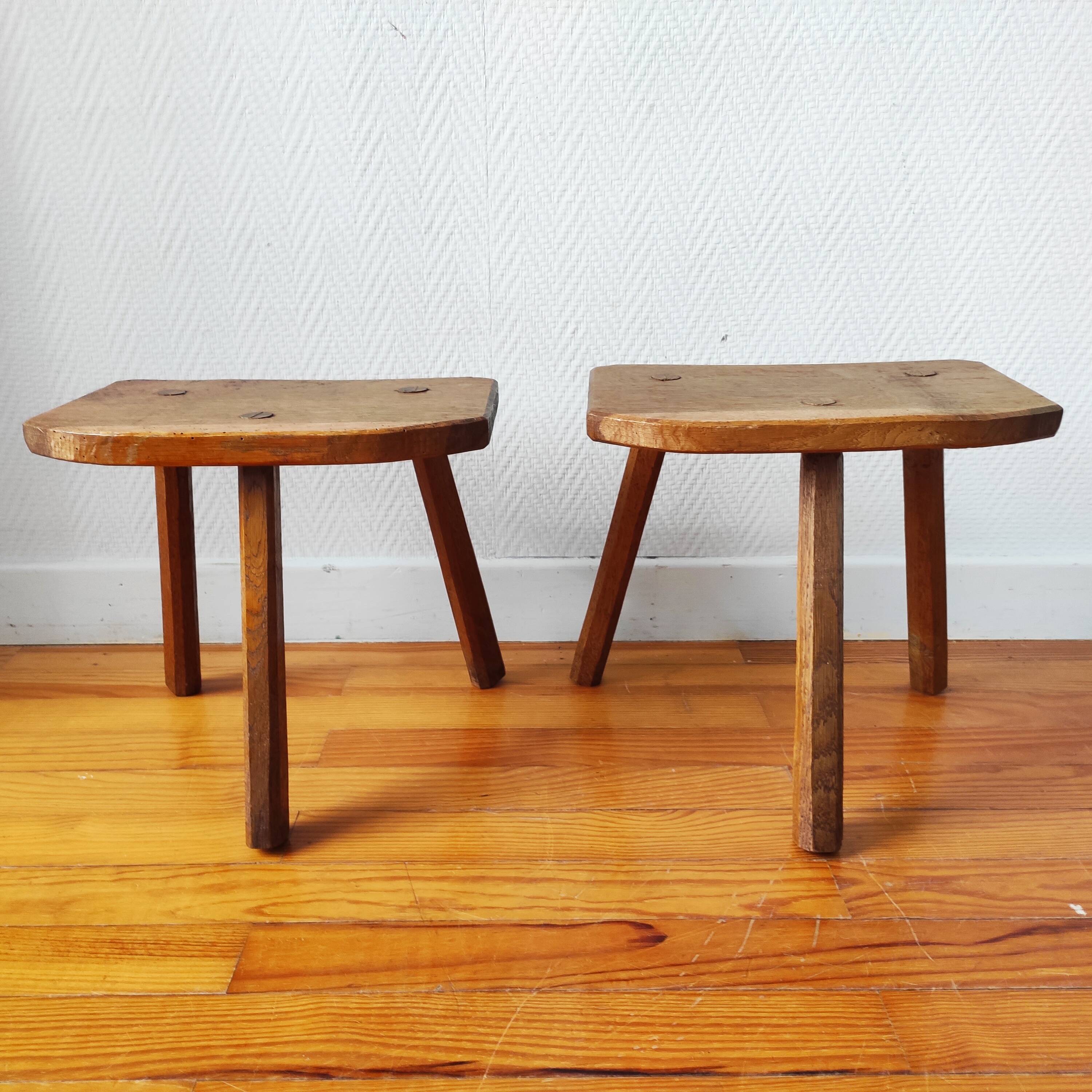 Pair of brutalist tripod stools in solid wood.