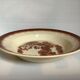 Earthenware plate from Moulin des Loups with stencil pattern.