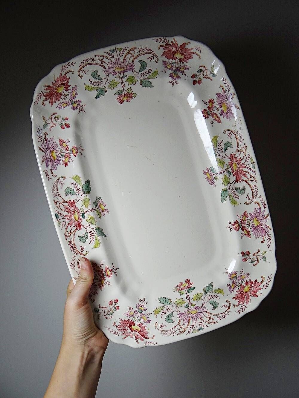 Antique Longchamp serving platter with polychrome daisies in ironstone.