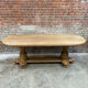 Massive oval monastery table in bleached oak with turned legs.