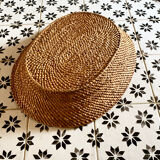 Basket in braided wicker and rattan