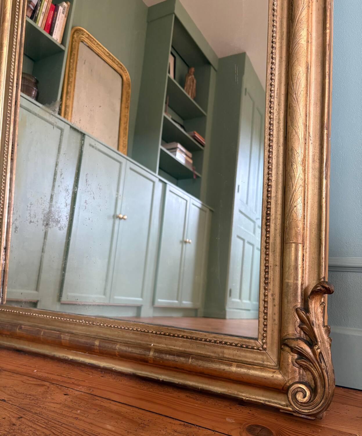 Louis Philippe mirror with a pediment featuring winged putti.