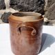 Trio of stoneware pots with lids
