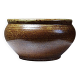 Vintage glazed stoneware bowl or planter in rustic wabi-sabi style.