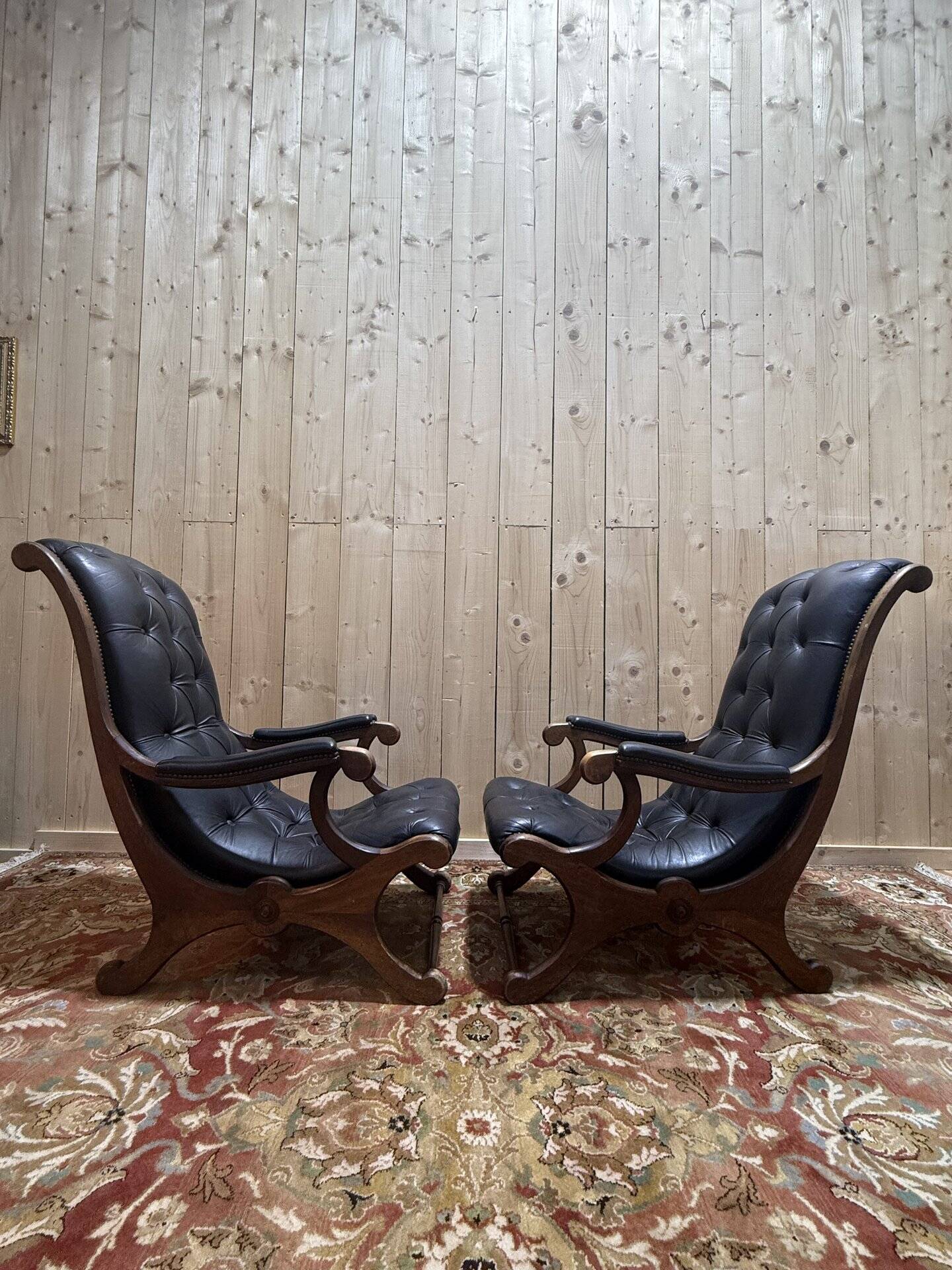 Pair of English Chesterfield armchairs in black leather