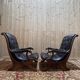 Paire de fauteuils anglais chesteefield en cuir noir