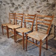 Set of 4 mid-century Italian dining chairs with woven seats, circa 1950–1970.