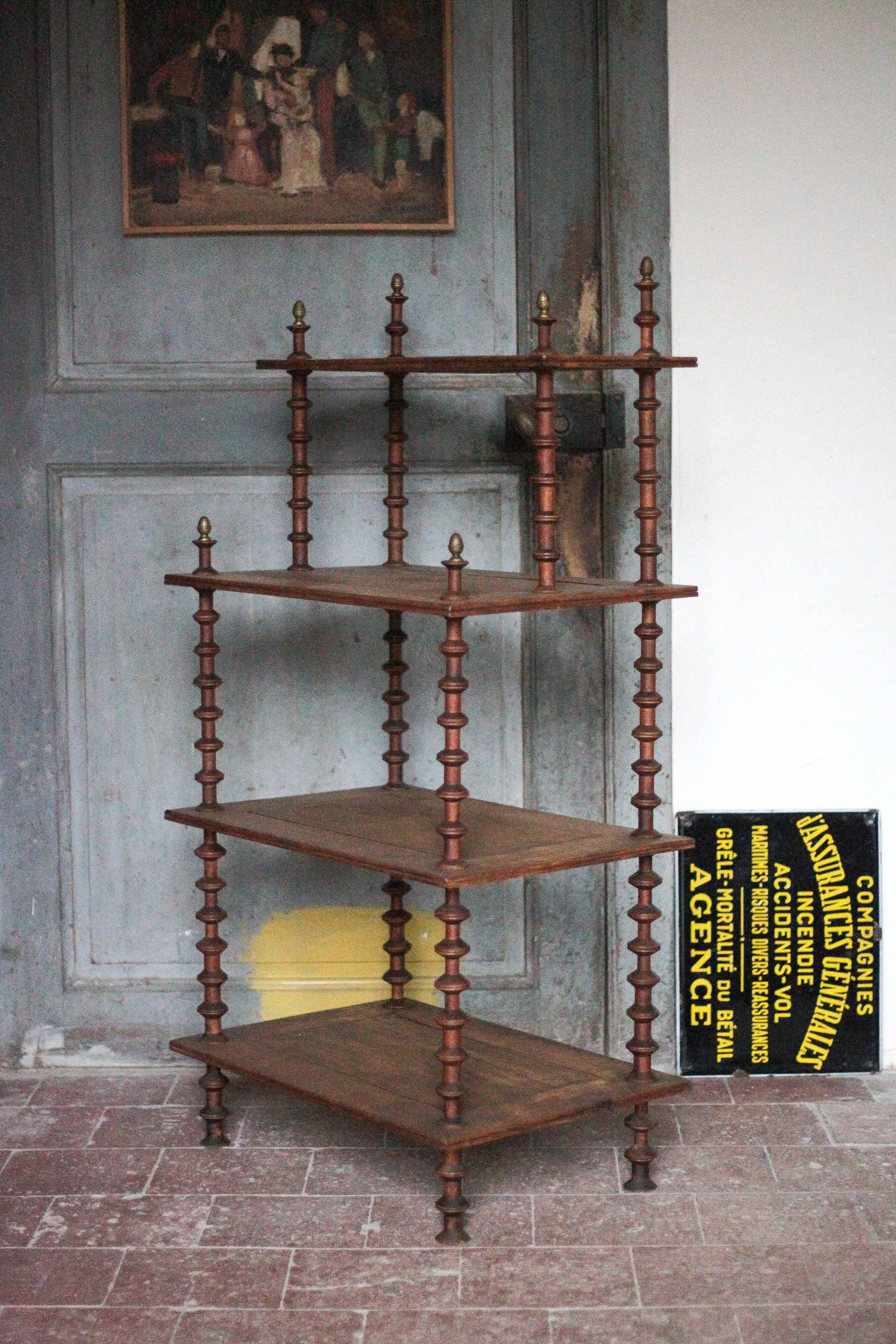 Napoleon III spool shelf, floor-standing shelf with brass tips.