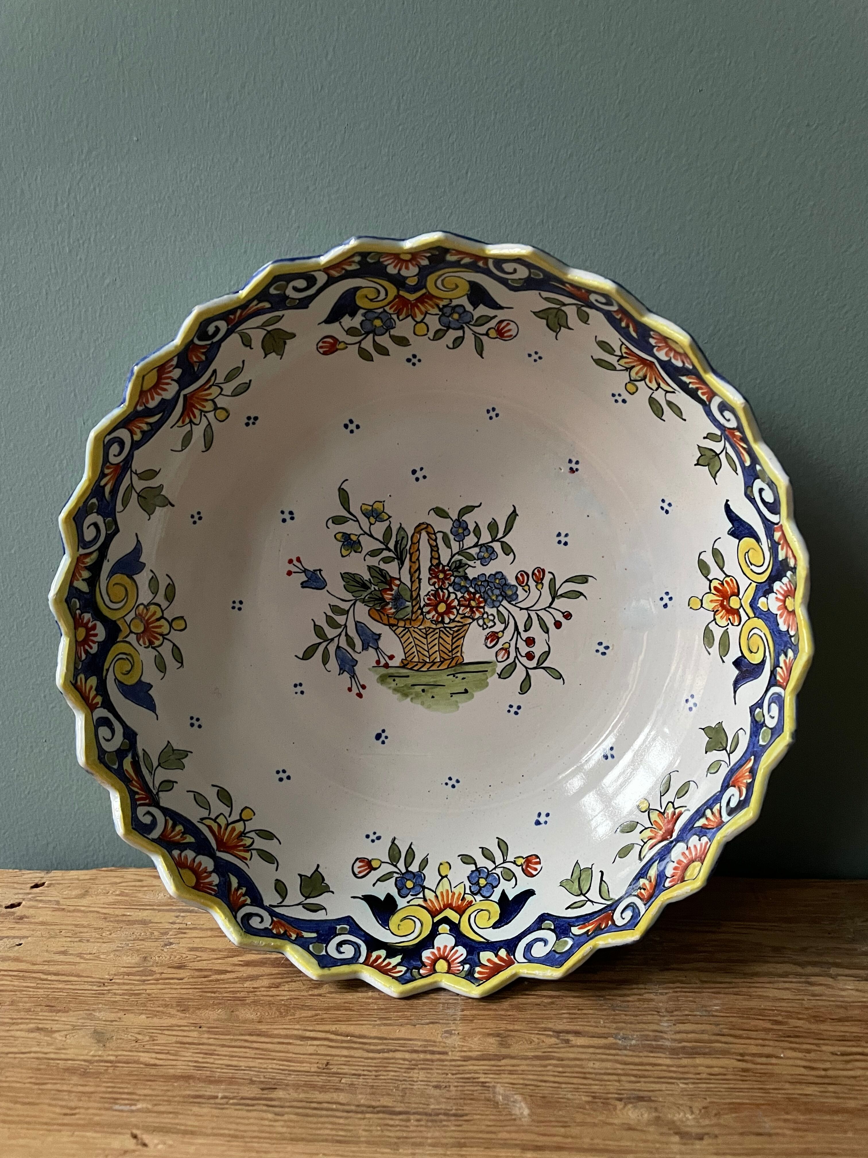 Hollow round dish in Rouen earthenware