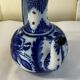 Glazed ceramic carafe with floral decoration