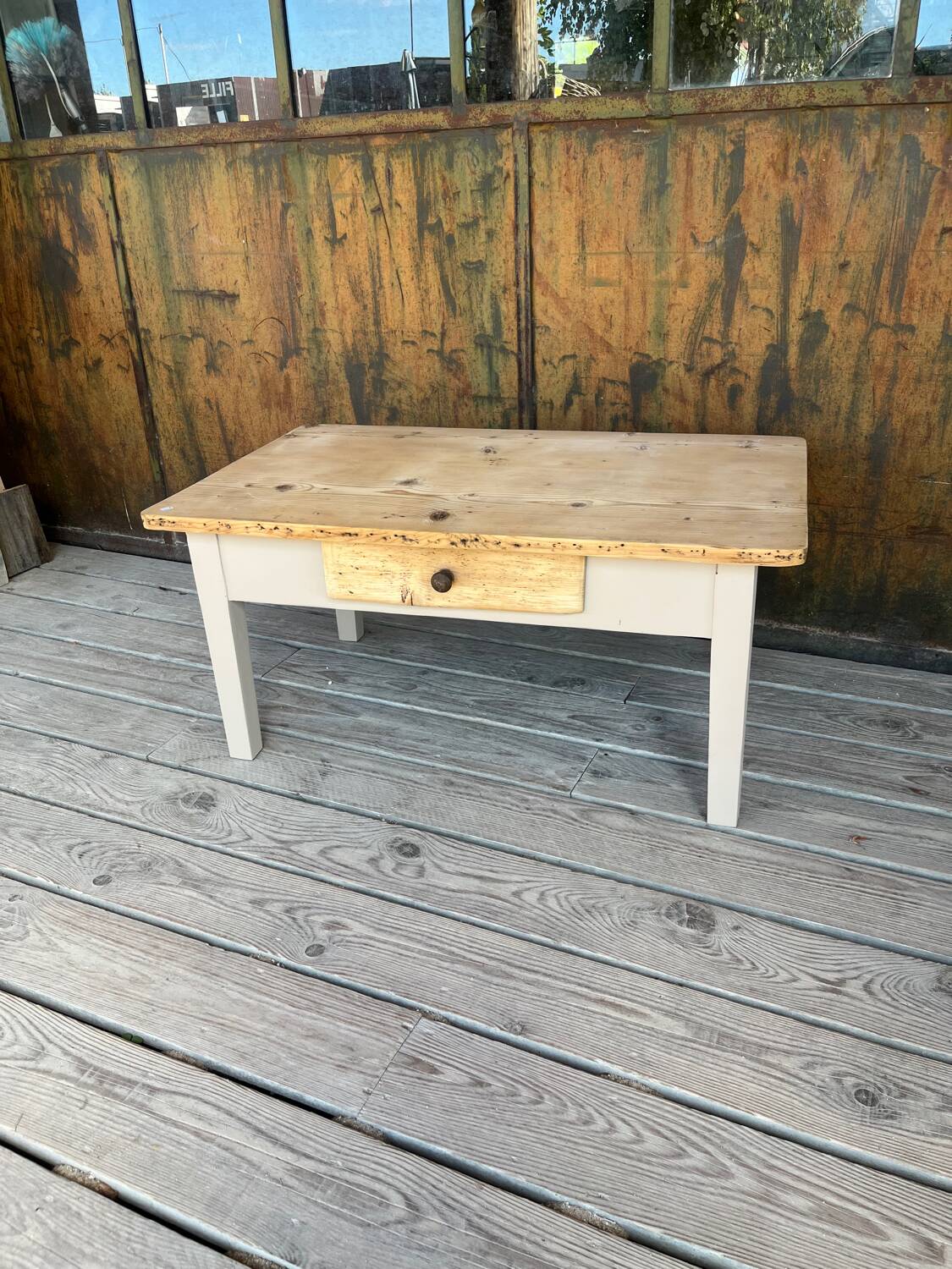 Raw wood and taupe coffee table