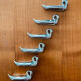 Case of 6 silver-plated knife rests in the shape of swans from the 1970s/80s.