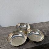 Silver-plated metal dish topped with an acorn