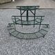 Old half-moon wrought iron plant holder