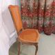 Caned chair in Louis XV style painted orange.