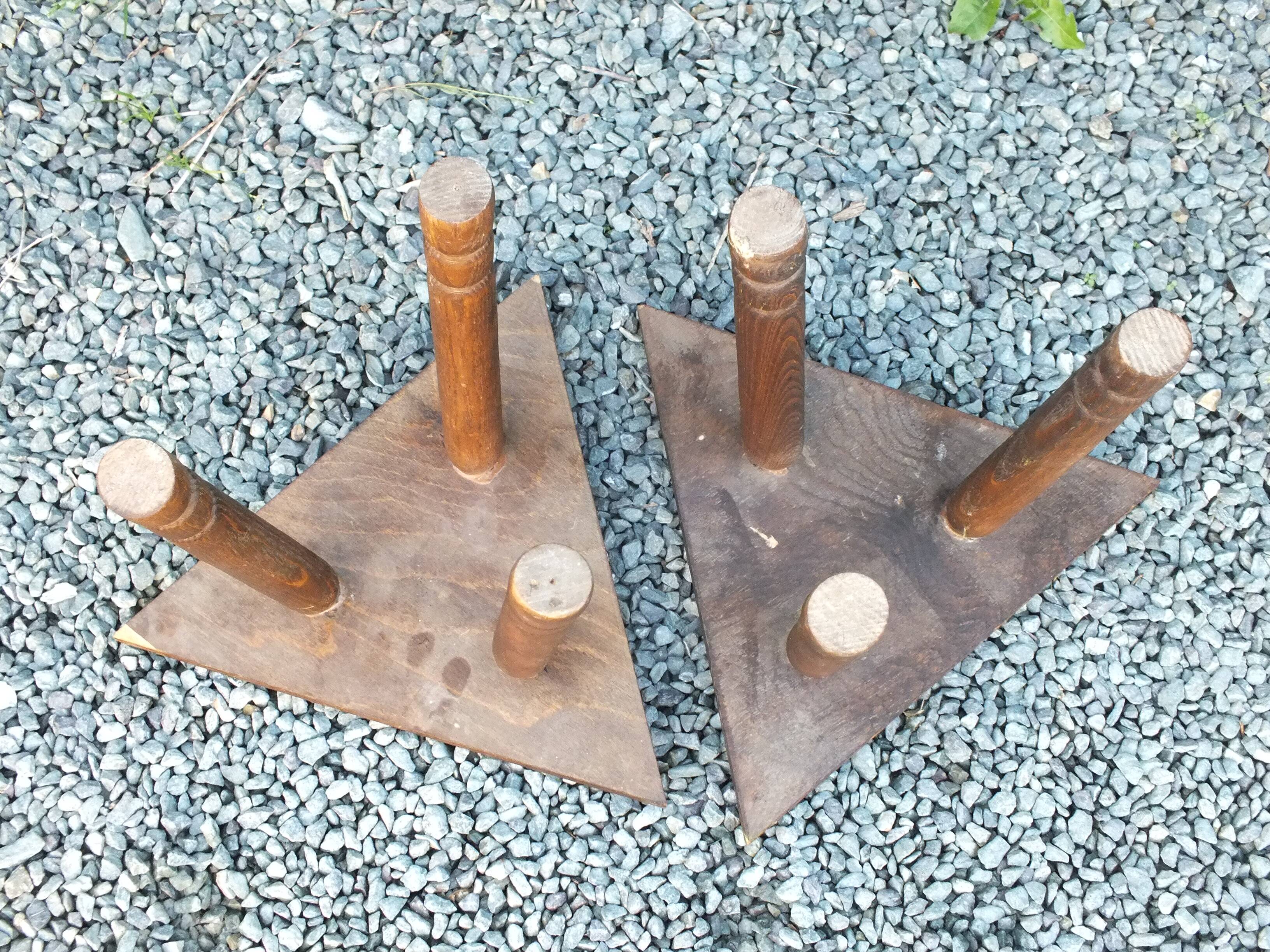 Pair of triangular turned wood stools or harnesses