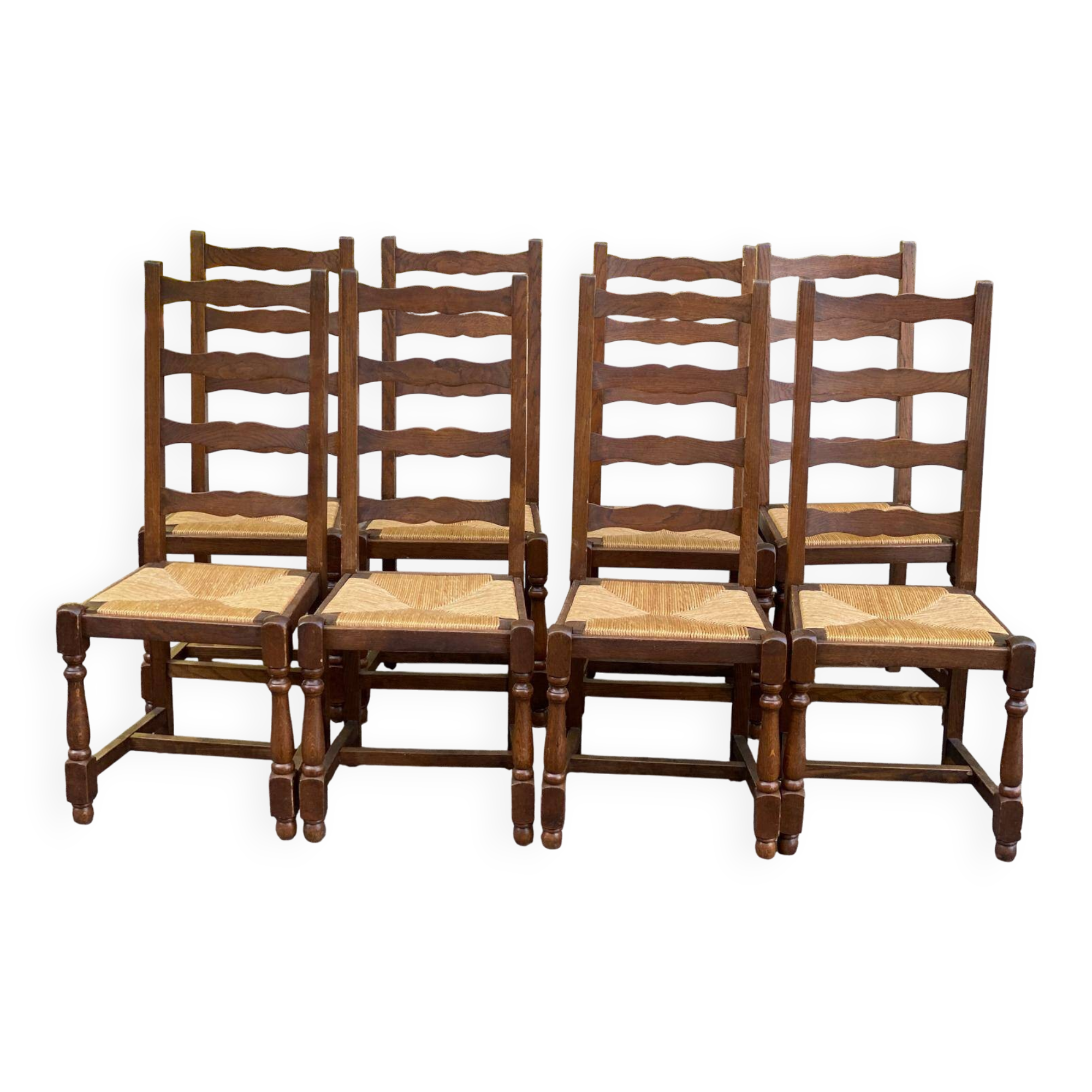8 solid oak chairs in medium oak with straw, farmhouse style, high back.