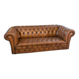 Fawn-colored tufted Chesterfield sofa