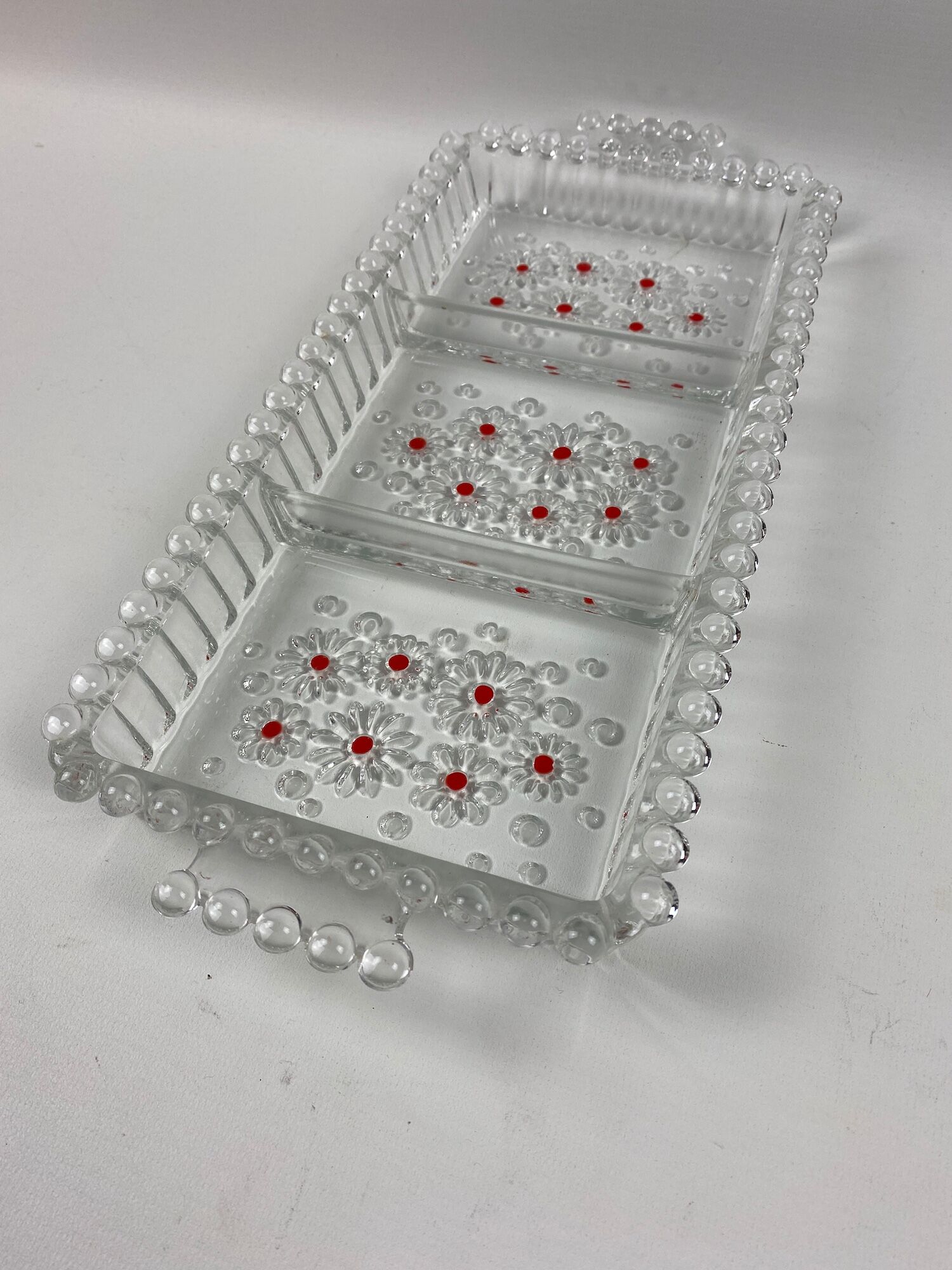 Glass compartmentalized dish patterned flowers and balls