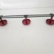Vintage black and red coat rack with 3 hooks from the 1960s.