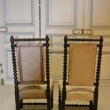 Pair of low armchairs in blackened wood