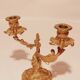 Old candle holder in gilded bronze