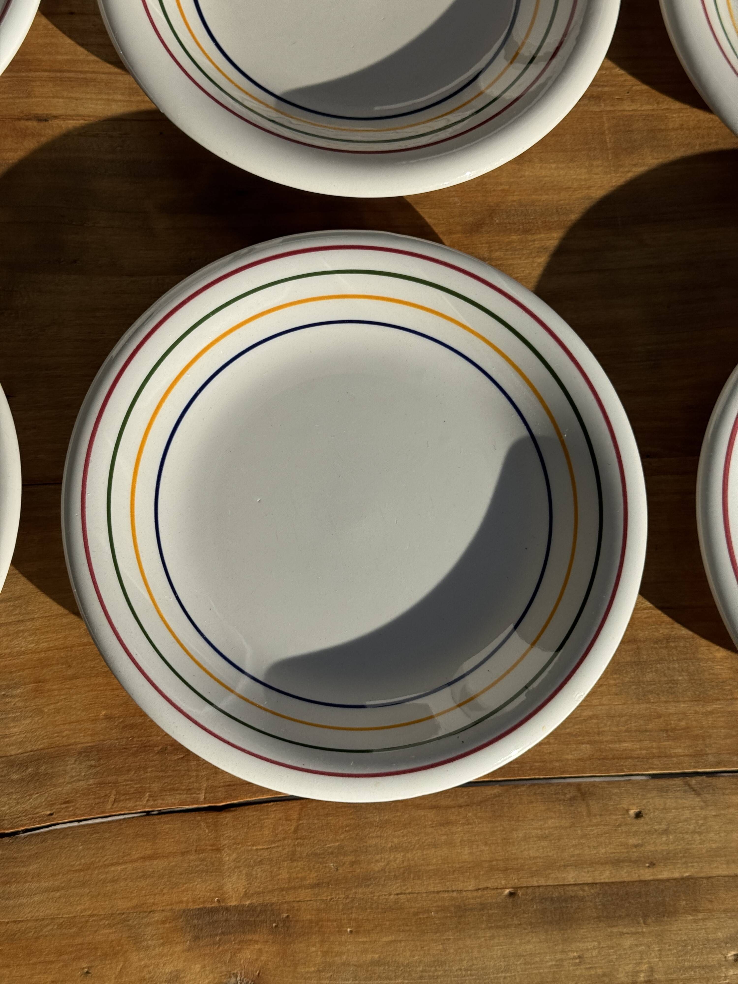 Set of 9 small Italian dessert plates Primula with red and green trim.