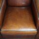 A very beautiful set of 2 Art Deco design armchairs in sheep leather