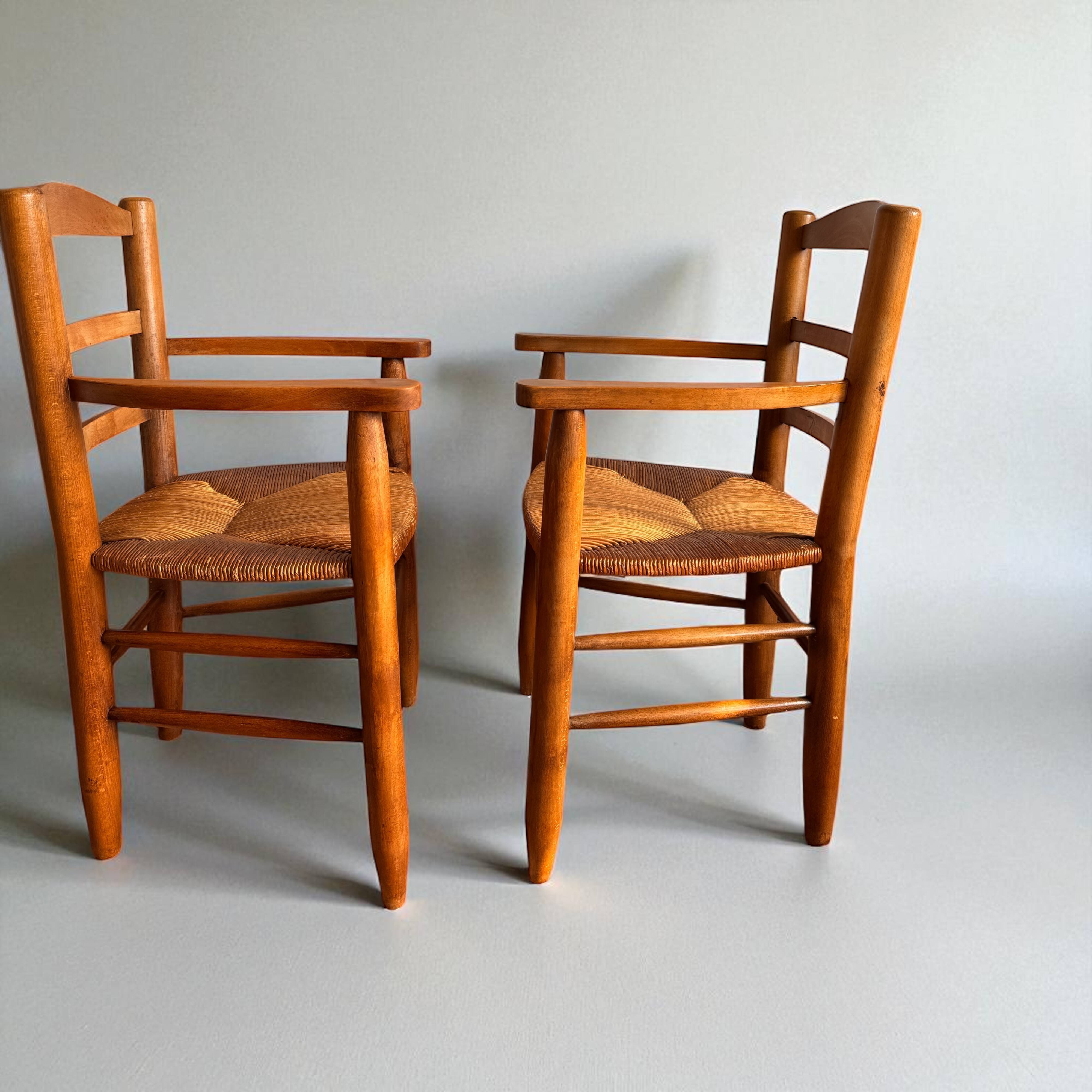Pair of vintage armchairs in solid wood and straw – Georges Robert