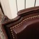 Fauteuil cabriolet Louis XVI couvert cuir marron foncé